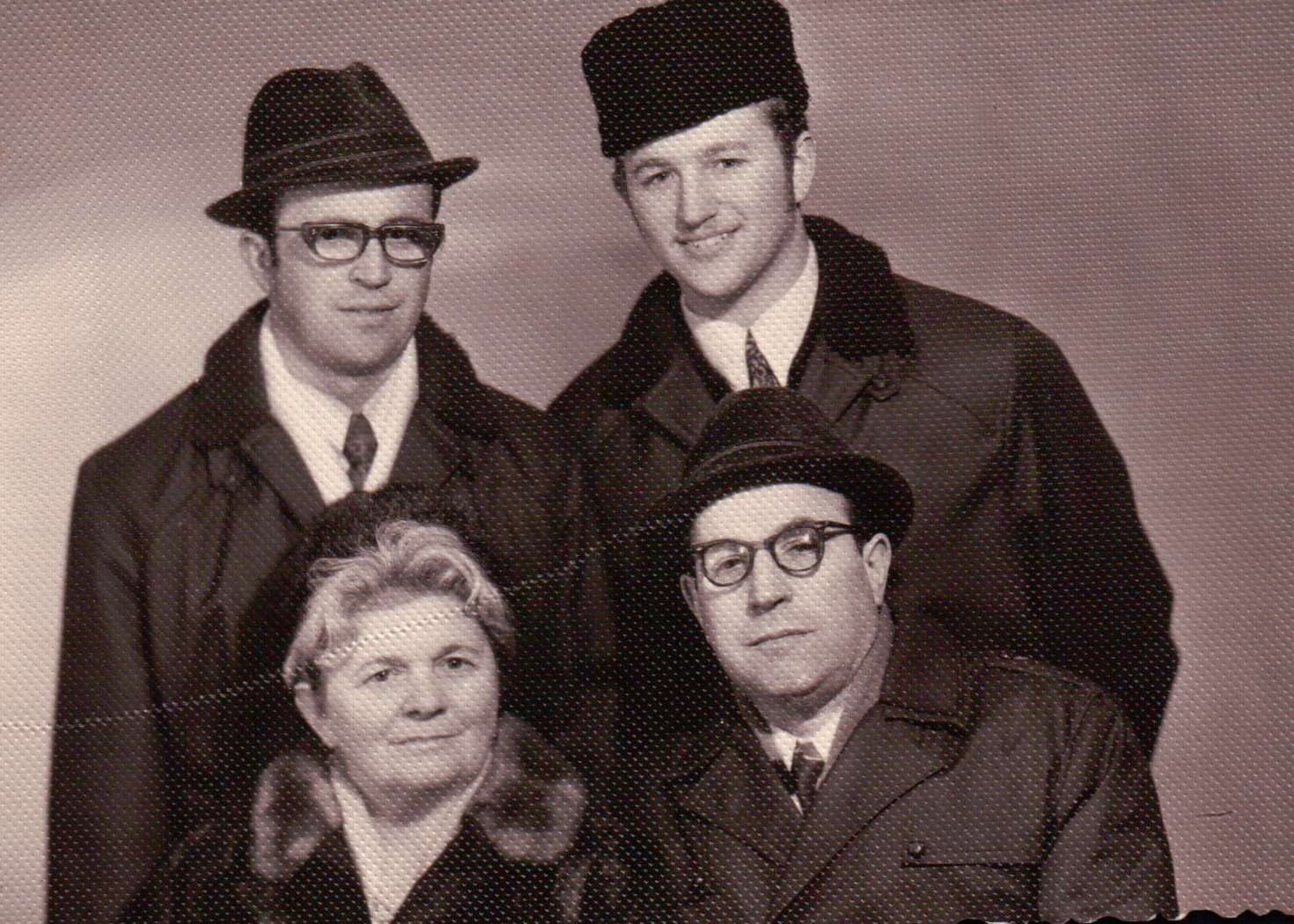 Family portrait: Masha, Alexander, and both sons in winter coats.