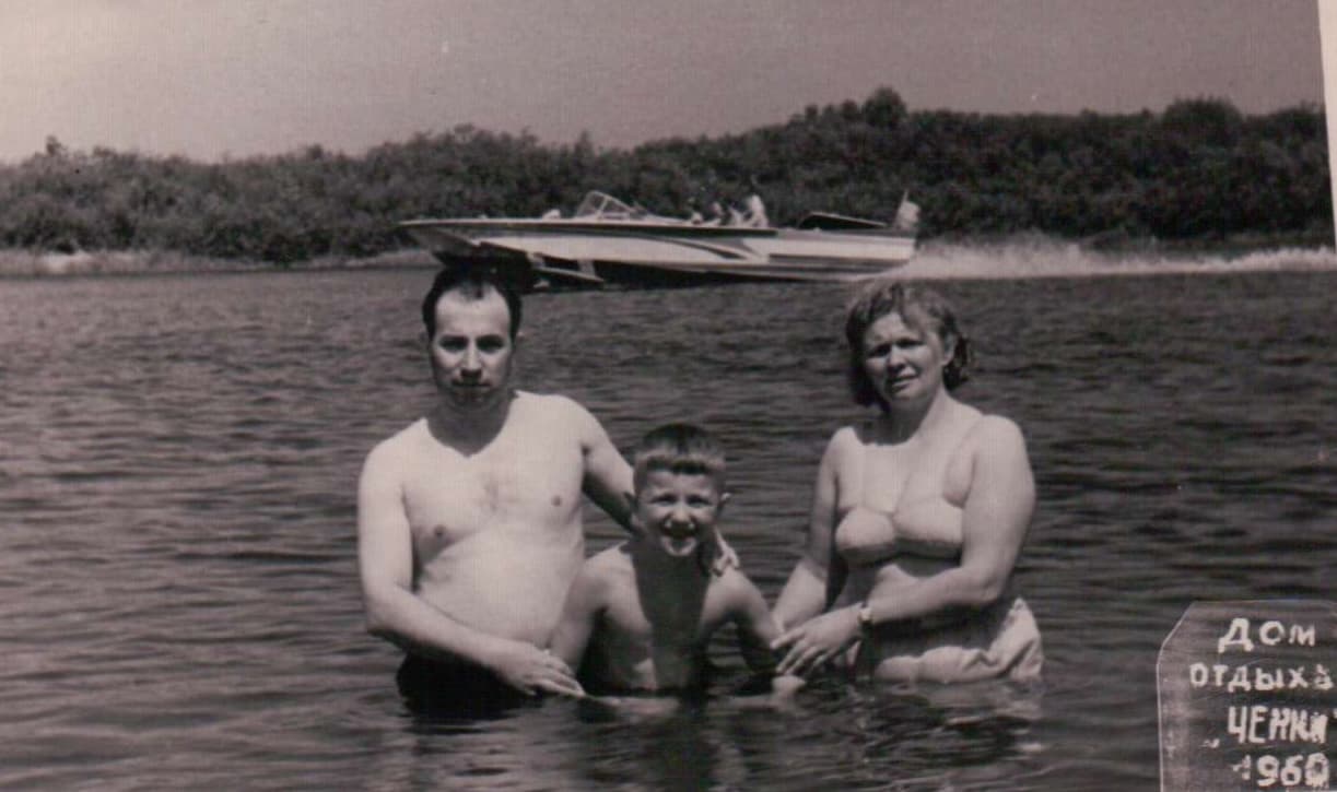 Masha, Alexander, and young son swimming at a resort. Stamp reads Chenki 1960.